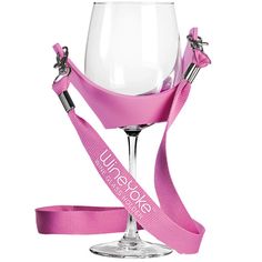 a wine glass with a pink ribbon around it