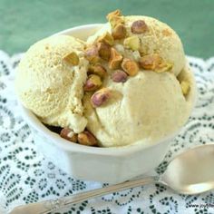 a bowl filled with ice cream and nuts