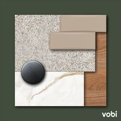 an assortment of different colors and materials on a wall with a black object in the middle