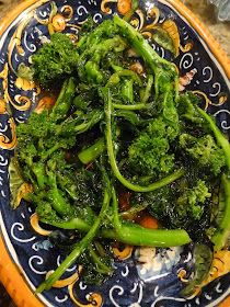 broccoli and other vegetables on a blue and yellow plate