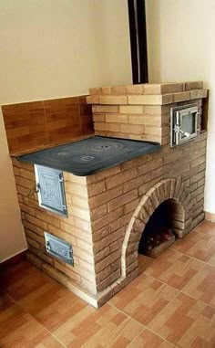 an oven built into the side of a wall in a room with tile flooring