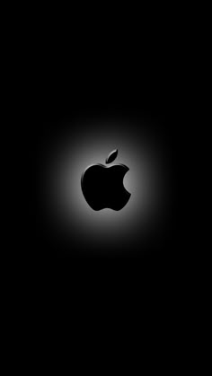 an apple logo is shown in the dark