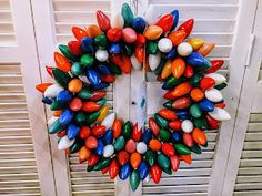 a wreath made out of candy canes on top of a door