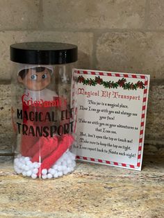 What better start to carry your elf with you without taking away the magic? This is a safe way to carry your elf and take him or her from one place to another. Jars are plastic and hold one elf doll.  Choose between a generic elf transport or a personalized jar with your elf's name.  Generic jar reads Magical Elf Transport . Personalized jar reads Elf's Name Magical Transport. Do Not Open is in green on the top of the canister.  Canister is decorated with red candy canes and white snowflakes.  J Elf Travel Jar, Elf Carrying Case, Elf On The Shelf In Jar To Carry, Elf On The Shelf Travel Jar, Elf Transport Jar, Elf Farting In A Jar, Elf Donate Toys, Travel Jar, Elf Names