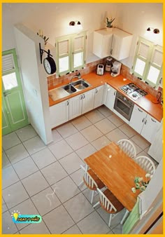 an aerial view of a kitchen and dining area