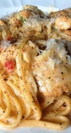 pasta with meat and sauce on a white plate