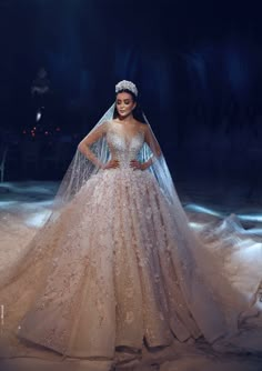 a woman in a wedding dress on the runway