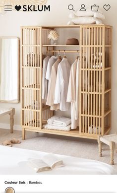 an open bamboo wardrobe with clothes hanging on it