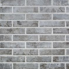 an image of a brick wall that looks like it is made out of cement bricks