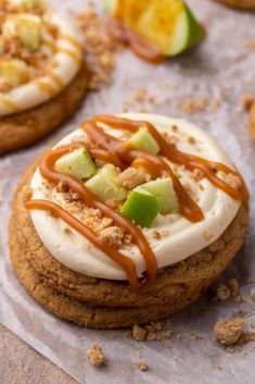 some cookies with icing and toppings on top