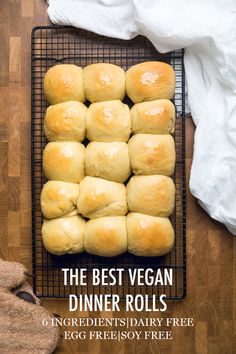 the best vegan dinner rolls on a cooling rack with text overlay that reads, the best vegan dinner rolls