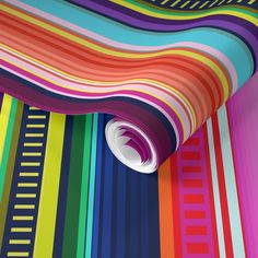 a multicolored striped wallpaper with a circular hole in the center and vertical lines at the bottom