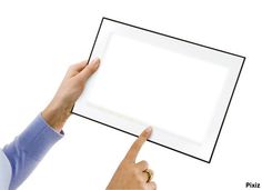 a person holding up a white board with two fingers