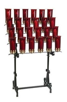 a rack that has many red candles on it