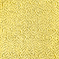 yellow textured paper with small diamond shapes