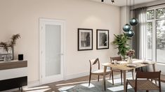 A white wood door with frosted glass in a modern dining room with Scandinavian-style furniture and beige walls Interior Wood Doors, Door Kits, Wood Doors Interior