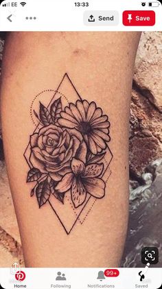 a black and white flower tattoo on the leg