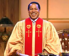 a man in a priest's outfit standing next to pots and pans