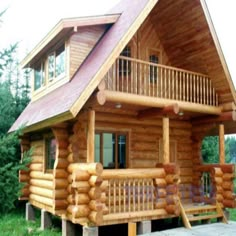 a small log cabin with porch and stairs