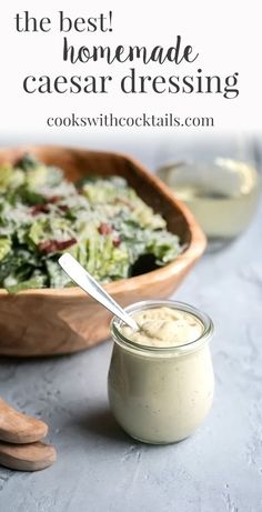 the best homemade caesar dressing is in a wooden bowl with a spoon next to it