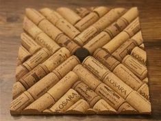 a close up of a cork coaster on a wooden surface