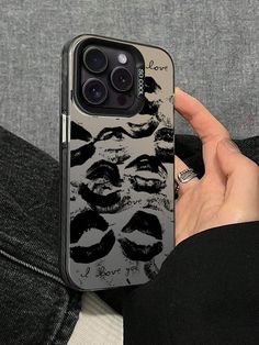 someone is holding up their phone case with the image of marilyn monroe's lips on it