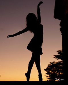 the silhouette of a girl in a short dress