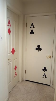 an open door with playing cards painted on it