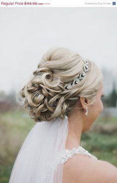 a woman with blonde hair wearing a tiara