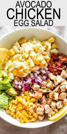 a bowl filled with chicken, lettuce and other ingredients to make an egg salad