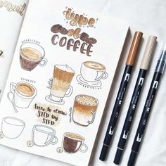 the coffee recipe book is next to three markers and two pencils