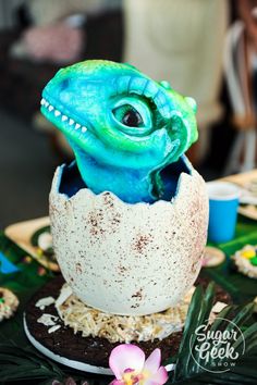 there is a blue lizard in an egg shell