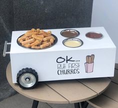 a white box with some food on top of it