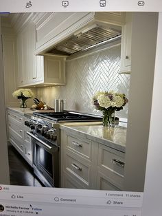 an instagram photo of a kitchen with flowers on the counter and in the oven