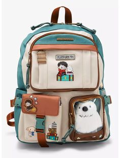 a backpack with an image of a dog and ghost on the front, attached to it