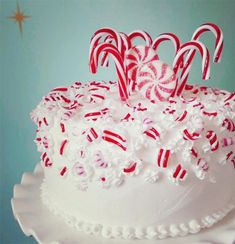 a white cake topped with lots of candy canes