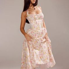 Why You'll Love It: Introducing our stunning Isolde Floral Midi Dress, a perfect blend of timeless elegance and modern charm. Crafted with meticulous attention to detail, this dress features a beautiful array of delicate florals that evoke a sense of romantic nostalgia. The flattering midi length offers a sophisticated silhouette that gracefully skims the body, while the lightweight fabric ensures comfort and ease of movement. A cinched waist enhances your natural curves, and the soft, flowing s Lace Spring Dress, Summer Evening Dress, Stylish Midi Dress, Bodycon Evening Dress, Lace Halter Dress, European Dress, Halter Midi Dress, Romantic Dress, Pink Midi Dress