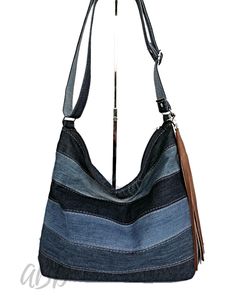 Recycled jeans bag Jeans handbag Jeans bag purse Large denim bag Denim handbag Denim purse bag Jeans purse Denim purse Denim bag Bag women Bags and purses Denim crossbody bag large jeans bag Every day bag FEATURES: designed to be worn over the shoulder or cross the body inside is 2 large opened pockets finished with durable lining MATERIALS: denim jeans lining zipper silver steel hardware COLORS: blue DIMENSIONS: Depth 14,9˝ / 38 cm Width 17.3˝ / 44 cm Length of adjustable straps 51,18˝ / 130 cm Feel free to contact me with any questions All of my products you can find here: https://www.facebook.com/SelenicAna/(copy-paste) https://www.etsy.com/shop/SelenicShop?ref=hdr_shop_menu Handbag Jeans, Jeans Handbag, Jeans Purse, Large Jeans, Recycled Jeans Bag, Denim Handbag, Purse Casual, Bag Jeans, Denim Street Style