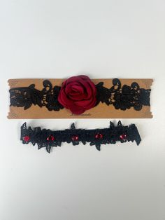 Beautiful appliqued black lace trim with beautiful red gemstones and high-quality handmade red rose on a stretchy fabric.  The belts are sewn to a beautiful matching organza stretch band for fit and comfort.  Each set includes two garter belts, one for tossing and one for keeping.  These wedding garter belts are one size fits all due to their stretchy, comfortable fabric. They can fit anywhere from 15.5" - 22.5" thighs.  The gems on the belts are beaded by hand. Black Lace Garter, Black Garter Belt, Lace Wedding Garter Set, Red Gems, Lace Garter Set, Black Garter, Wedding Garter Lace, Garter Belts, Wedding Garter Set