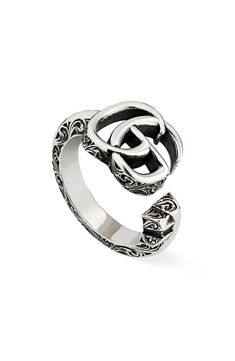 A prominent logo tops this open sterling silver ring that's richly textured with filigree engraving. Style Name:Gucci Gg Ring. Style Number: 6134028. Available in stores. Gucci Mane Wife Ring, Mens Gucci Rings, Mens Gucci Ring, Fake Gucci Ring, Matching Gucci Rings, Gucci Ring Women Silver, Gucci Silver Heart Ring, Gucci Rings Women, Gucci Men Ring