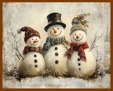 three snowmen wearing hats and scarves are standing in the snow with one another