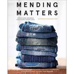 the book cover for mending matters with jeans stacked on top of each other