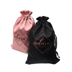 two black and pink drawsacks with the word adara in gold on them