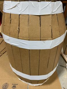 a cardboard barrel sitting on top of a table