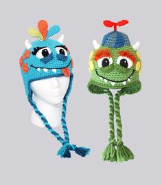 two crocheted hats with monsters on them