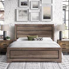 a bedroom with white brick walls and wooden furniture, including a large bed in the center