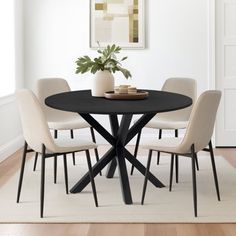 a black table with four chairs around it