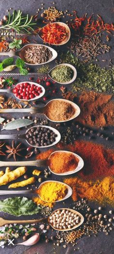 many bowls filled with different types of spices