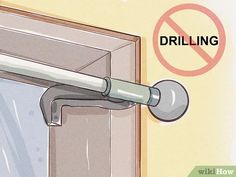 a no drilling sign on the side of a door next to a window with a curtain rod