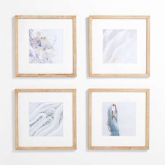 four framed photographs hang on the wall